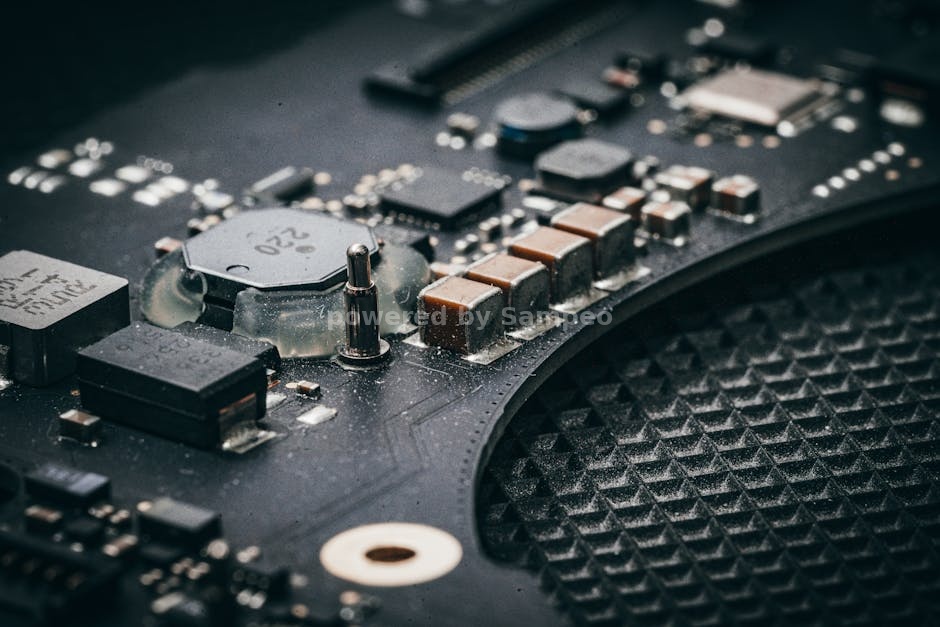 electric heated sweater technology - Detailed macro shot of an electronic circuit board showcasing various components.